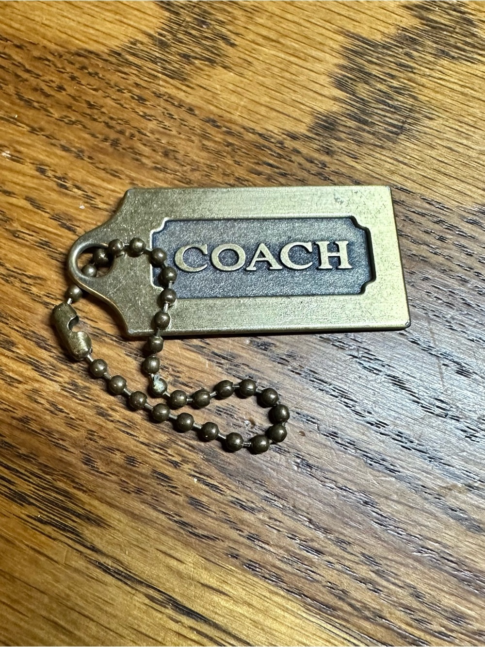 Coach Gold Tone Brass Logo Tag Keychain